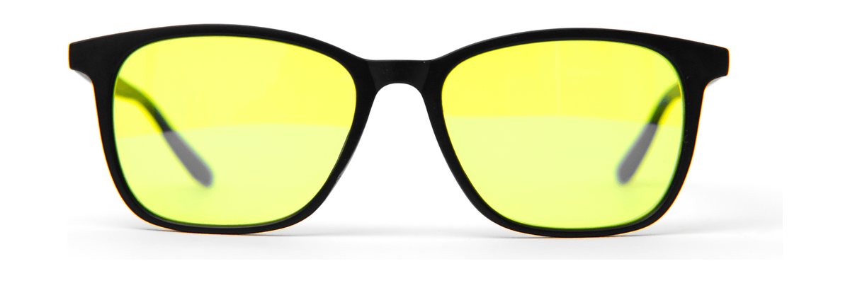 Lentes Alpha Clarity+: armazón negro con lente amarillo, vista de frente